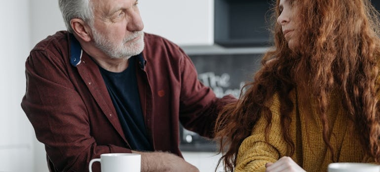 Two people talking about family roles in an addicted household