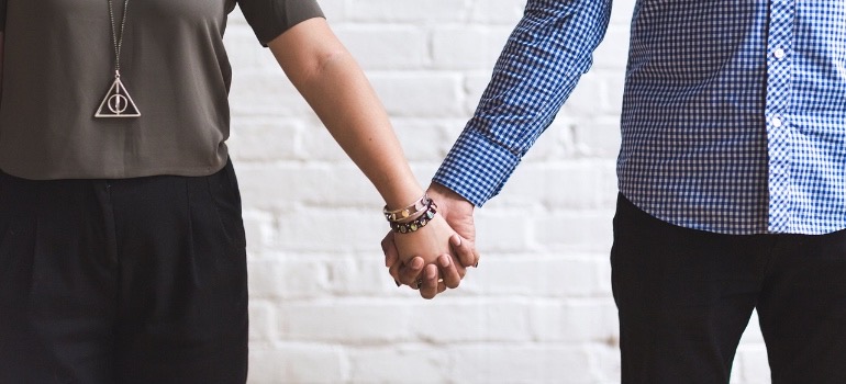 two people holding hands
