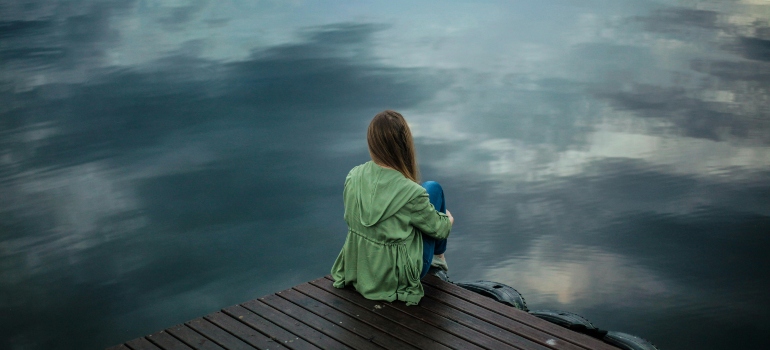 Isolated person struggling with triggers.