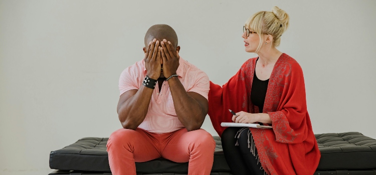 Person in therapy session focusing on emotional healing and mental health.