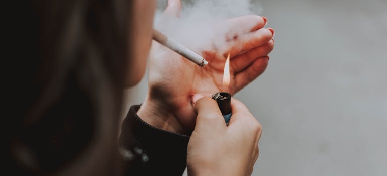 A woman using one of the common addictions people struggle