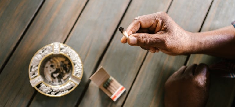 A person holding one of the common addictions people struggle with