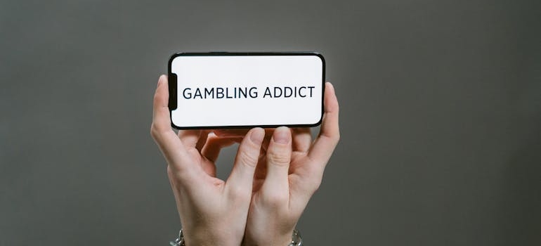 Gambling addict written on the phone