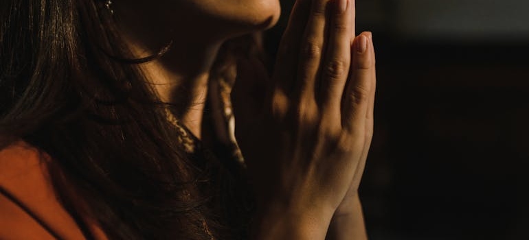 A woman using prayer practices for overcoming cravings