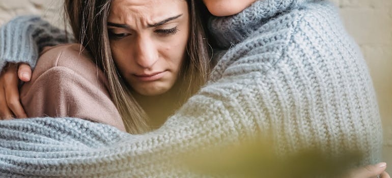 Two women hugging
