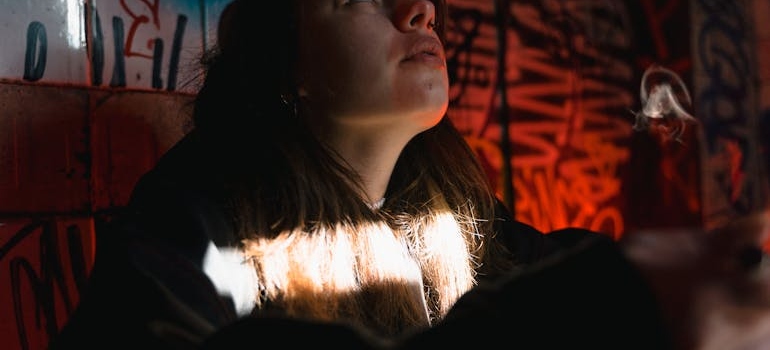 A woman thinking about how substance abuse is impacting communities across Virginia