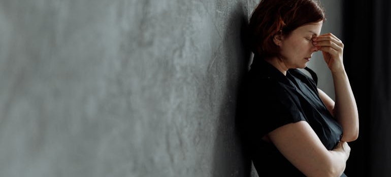 A woman thinking about stages of addiction and recovery