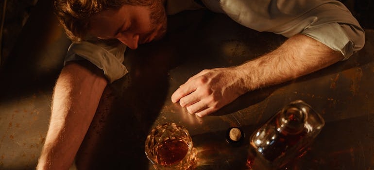 A drunk man sleeping on the table