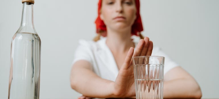 A woman with the glass in front of her