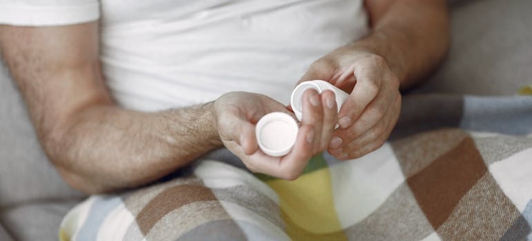 A person taking a pill and thinking about what Is Suboxone
