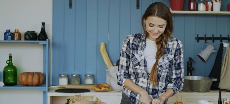A woman cooking and thriving in sobriety