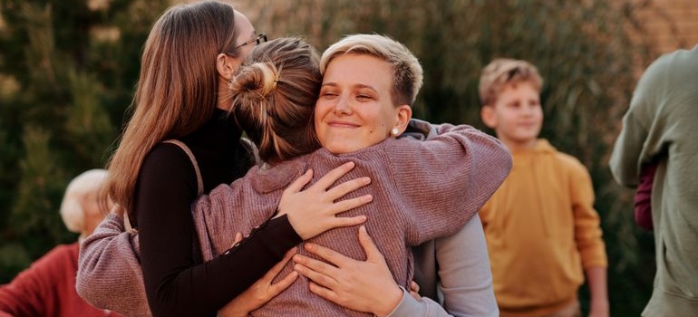 Family members embracing and supporting one another