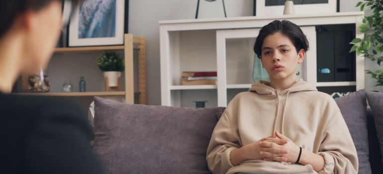 Teen talking with a therapist during treatment