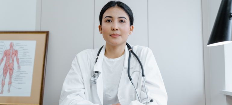 Healthcare provider sitting in a medical office